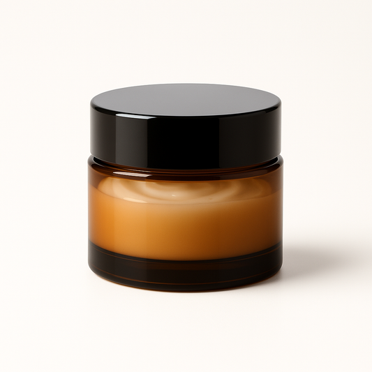 Amber glass jar with black lid on a white background
