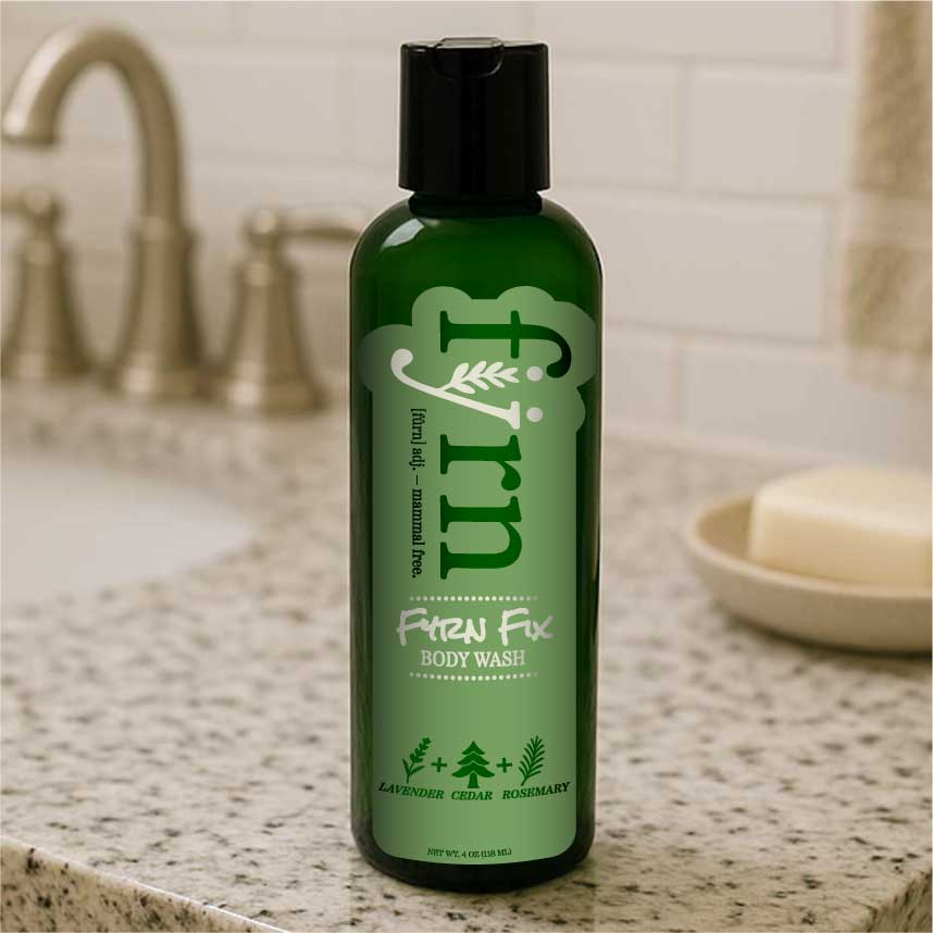 Green bottle of Fyrn Fix body wash on a bathroom counter