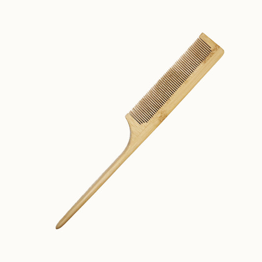 Wooden comb on a white background
