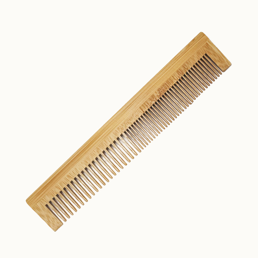Wooden comb on a white background