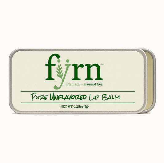 Fyrn pure unflavored lip balm container on a white background