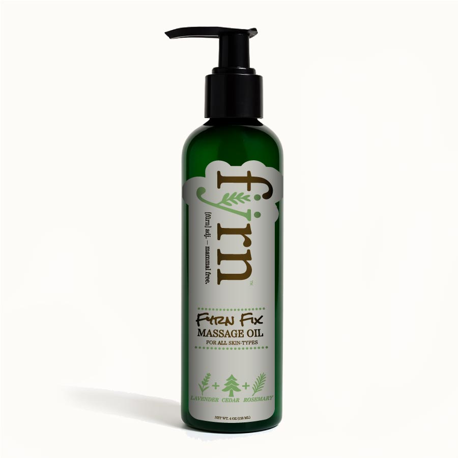 Green massage oil bottle with pump on a white background