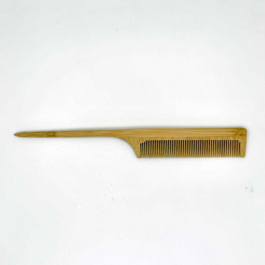 Wooden comb on a white background