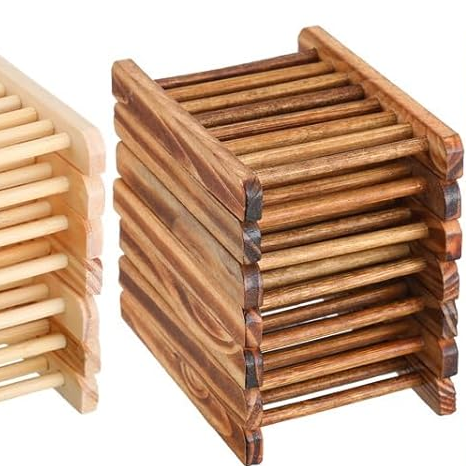 Wooden soap holders on a white background