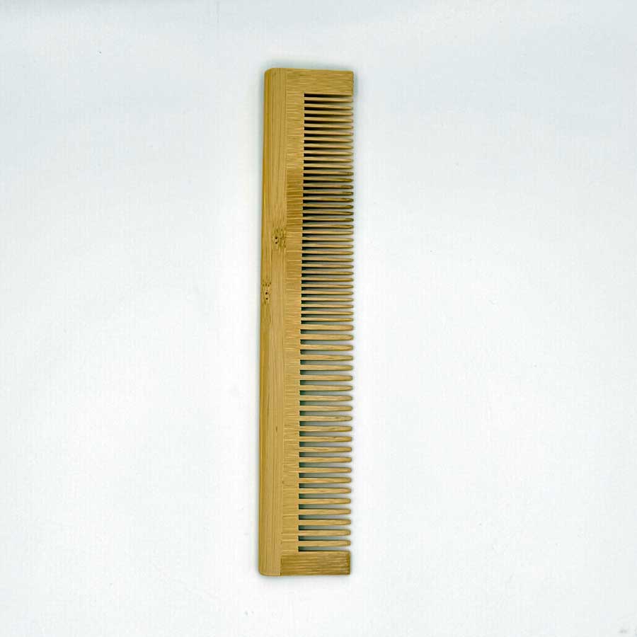 Wooden comb on a white background