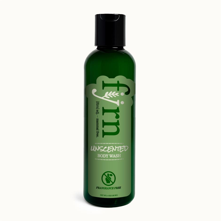 Green bottle of unscented body wash on a white background