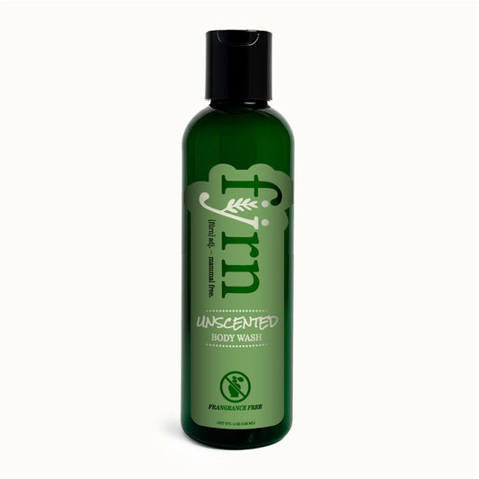 Green bottle of unscented body wash on a white background
