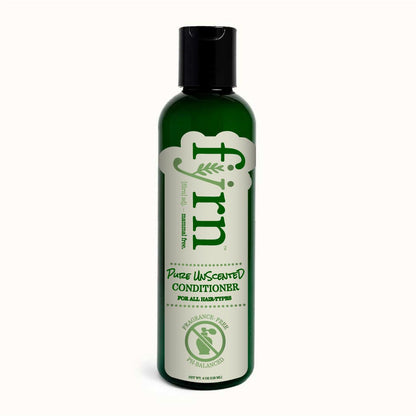 Green bottle of conditioner with black cap on a white background