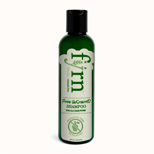 Green shampoo bottle with black cap on a white background