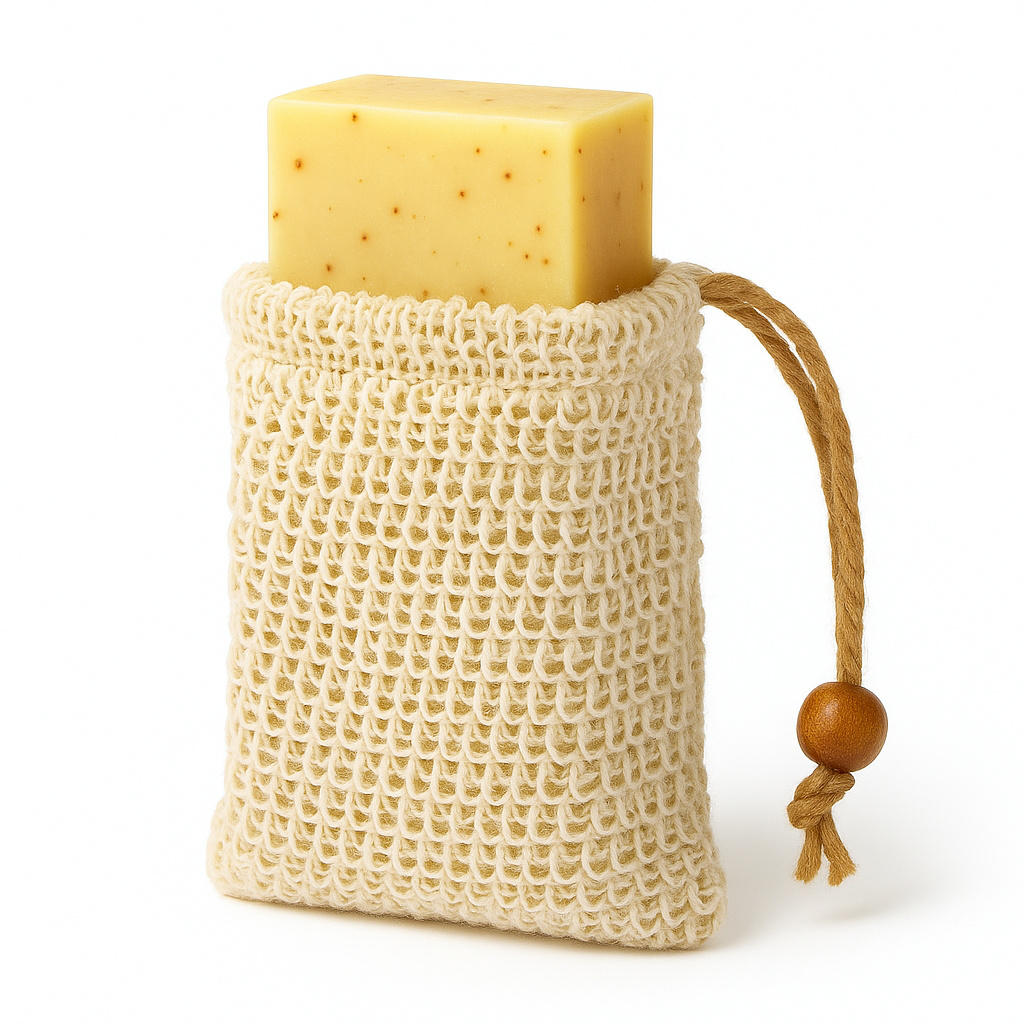 Bar of soap in a natural fiber bag with a wooden handle on a white background
